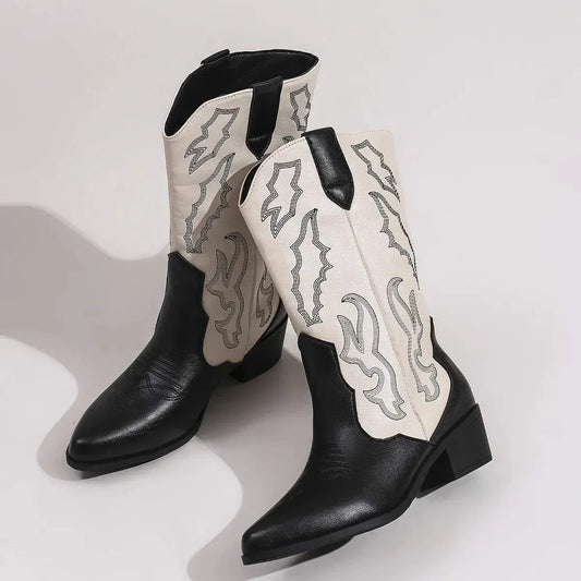 Point toe block heels boots in black and white PU leather with mid heels and decorative stitching