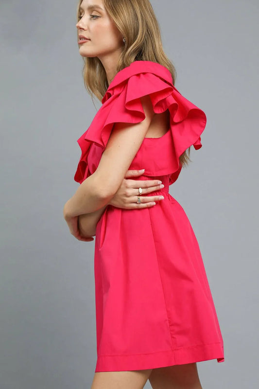 Woman wearing vibrant hot pink Umgee Double Ruffle Sleeve Dress with tiered ruffle sleeves and fit-and-flare silhouette