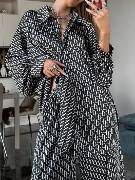 Oversized printed button up shirt and pants set in black and white geometric pattern, 100% polyester, machine washable