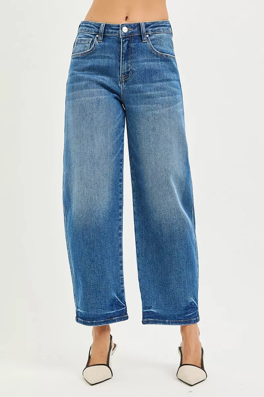 Front view of RISEN slouchy cropped barrel jeans in blue denim with pocketed detail and barrel leg design