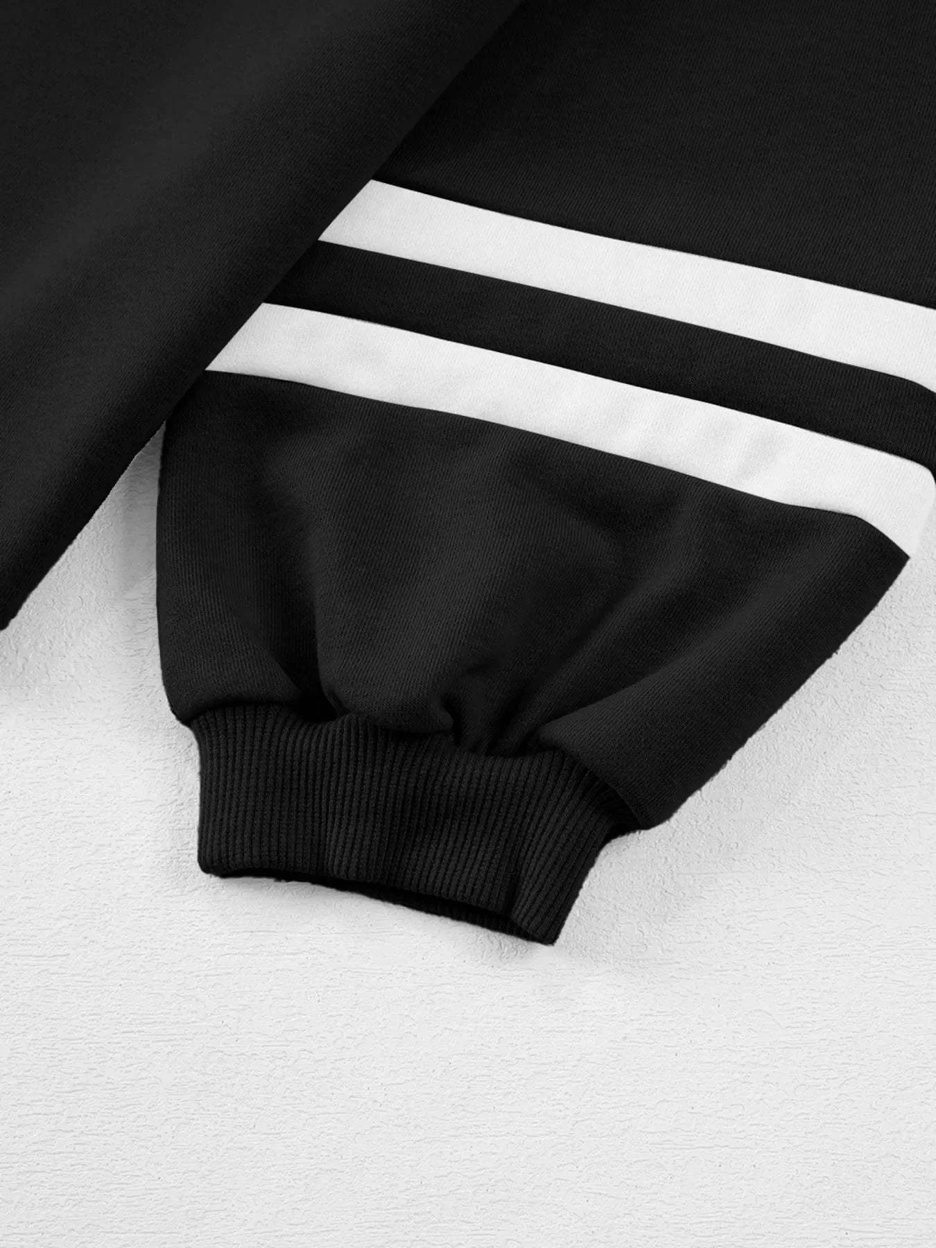 Black Contrast Trim Round Neck Top with white stripes and ribbed cuffs, part of two-piece set with drawstring pants.