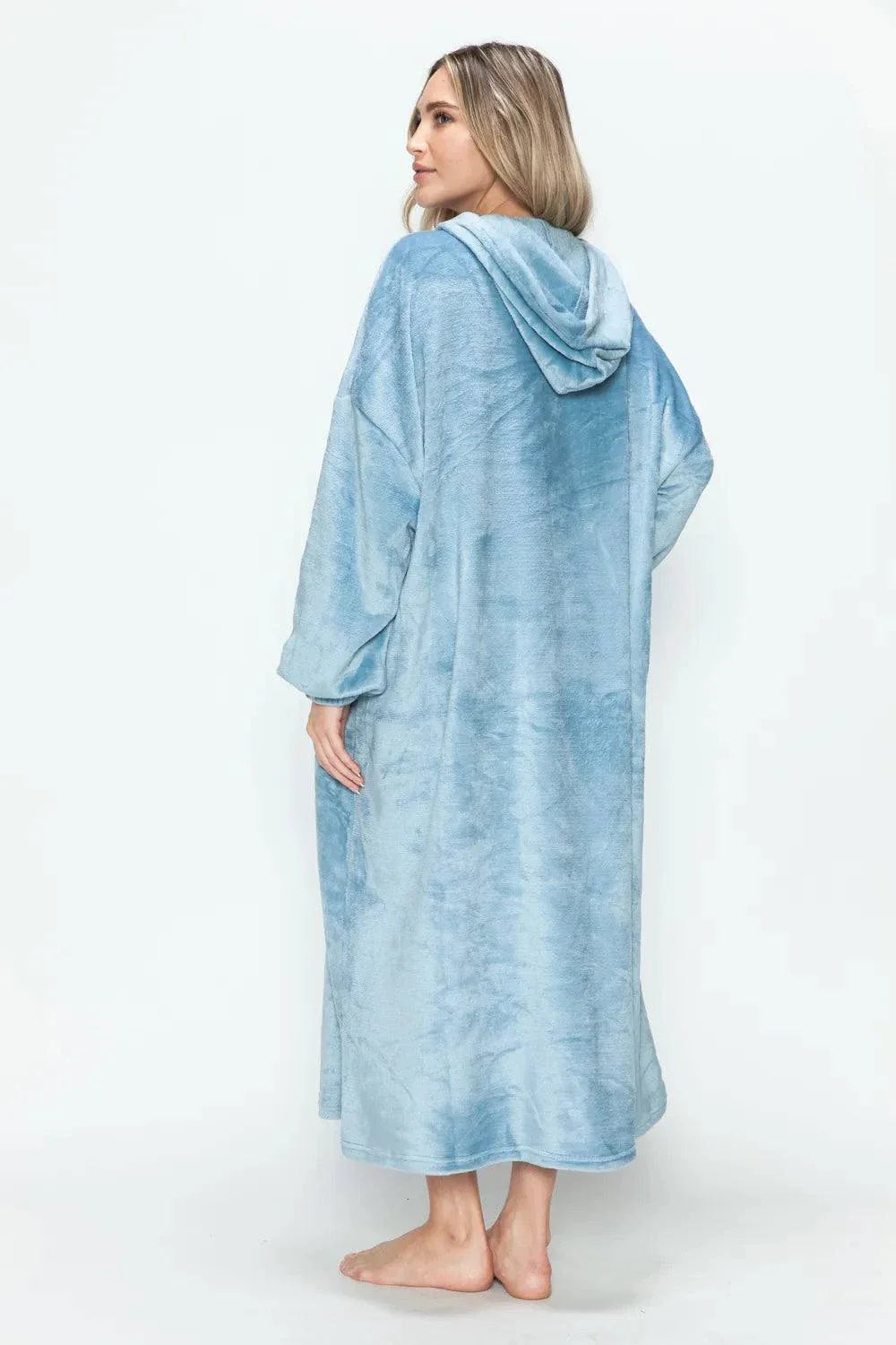 Woman wearing light blue hooded midi lounge dress with full-size pockets, back view