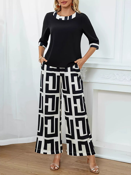 Black geometric print round neck top with matching wide-leg pants two-piece set