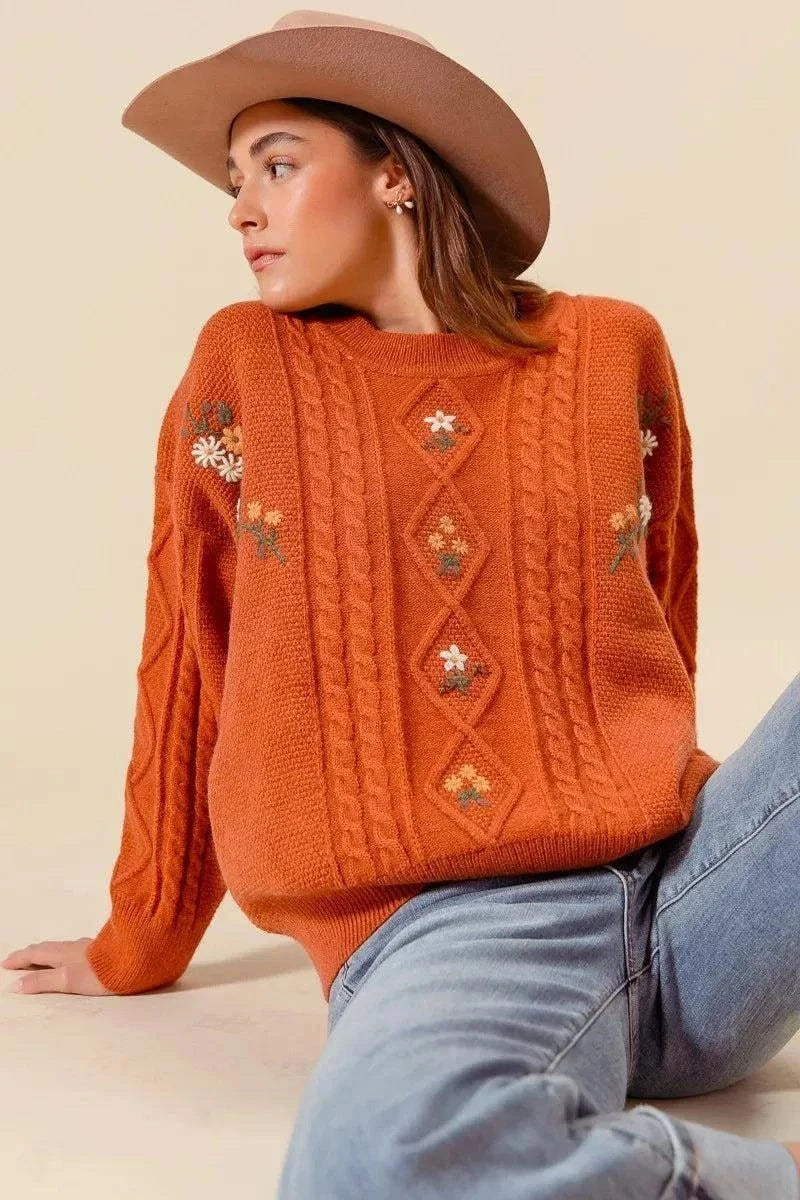 SO ME Embroidered Flower Cable Knitted SweaterElevate your winter wardrobe with this charming embroidered flower cable knitted sweater. The intricate floral embroidery adds a delicate and feminine touch to the cRedemption By Ashley NorthEmbroidered Flower Cable