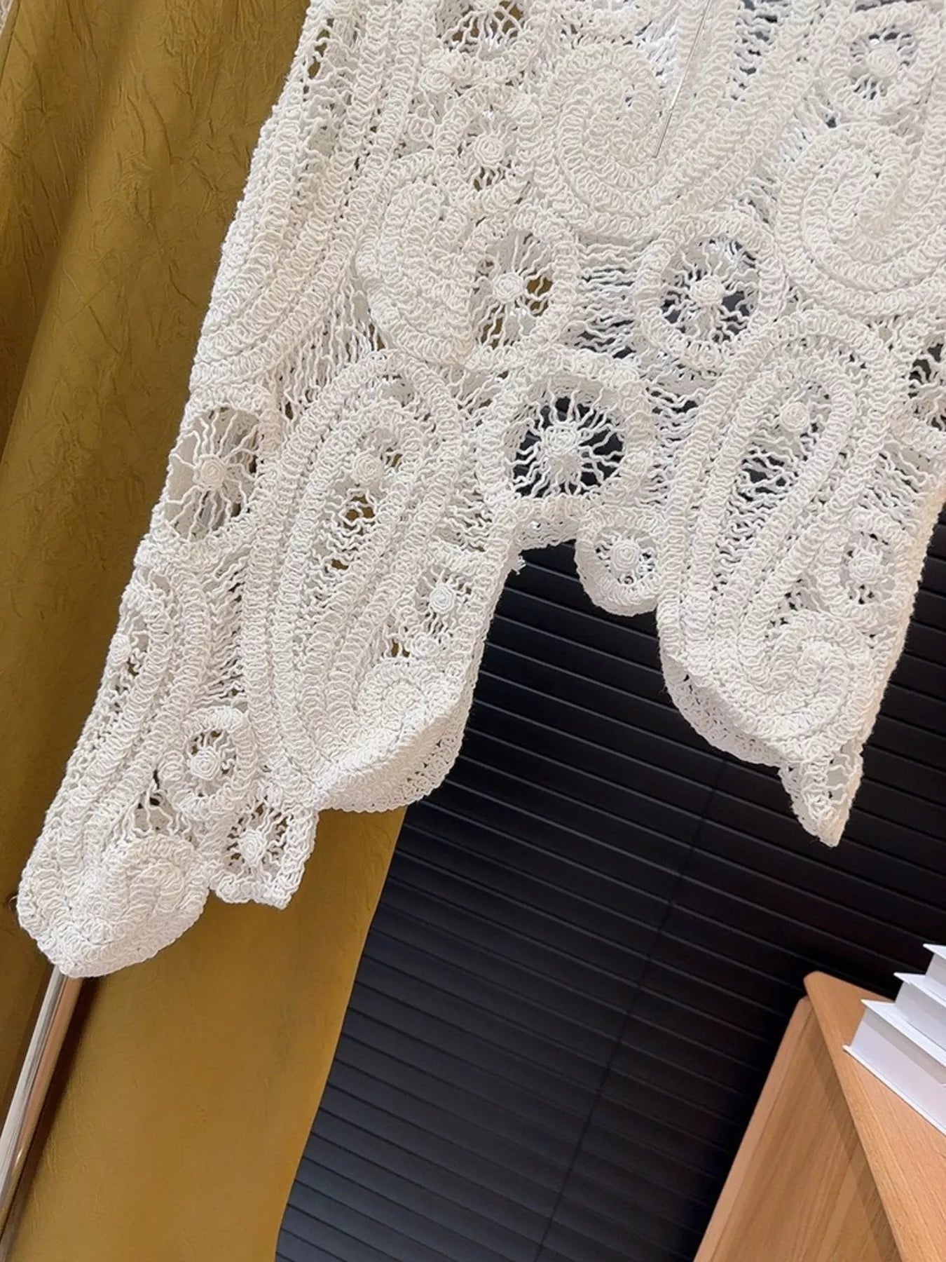 White crochet sleeveless tank with openwork and asymmetrical hem detail