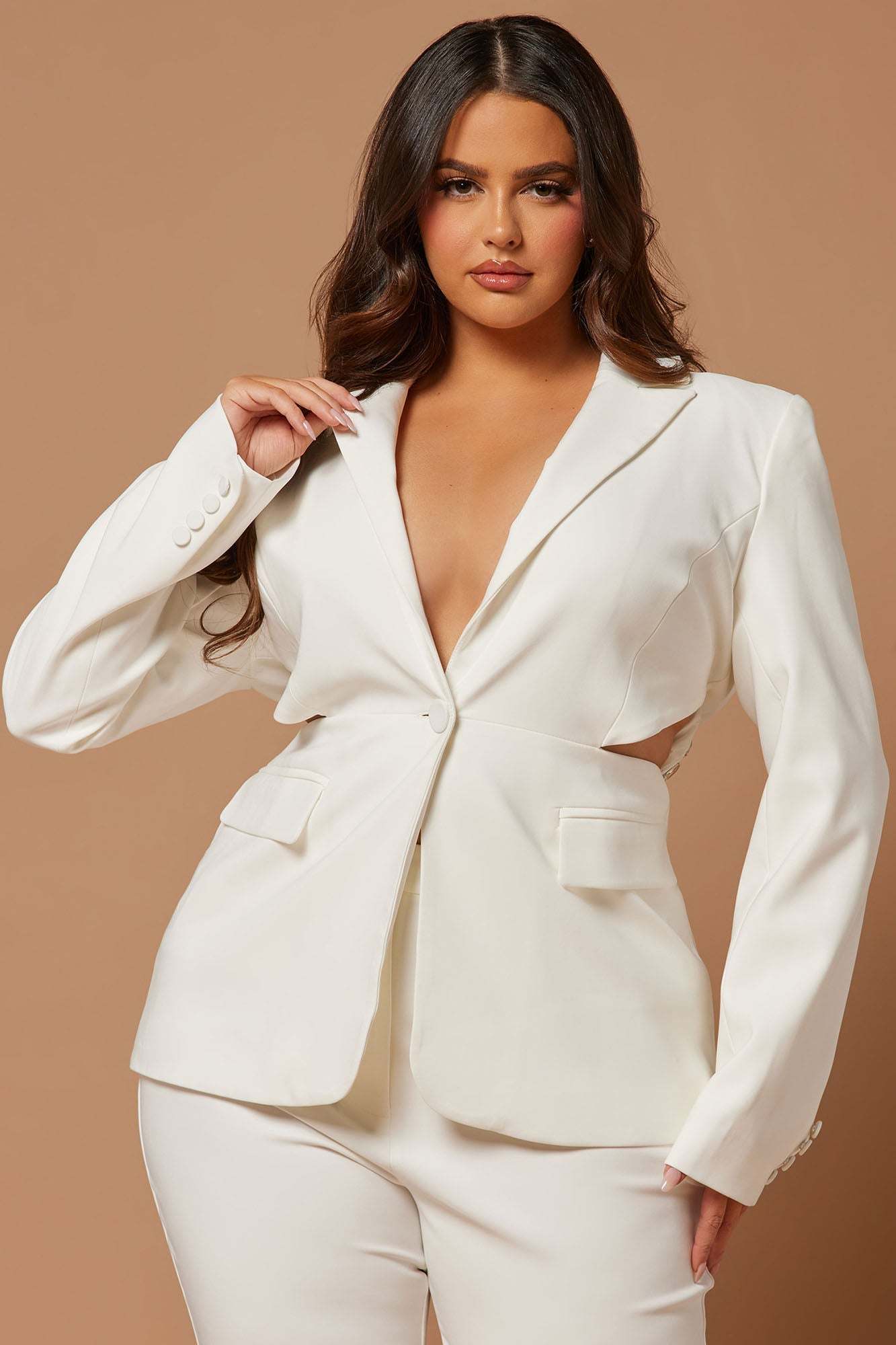 White Skyla Embellished Blazer Suit Set with tailored fit and deep neckline worn by woman