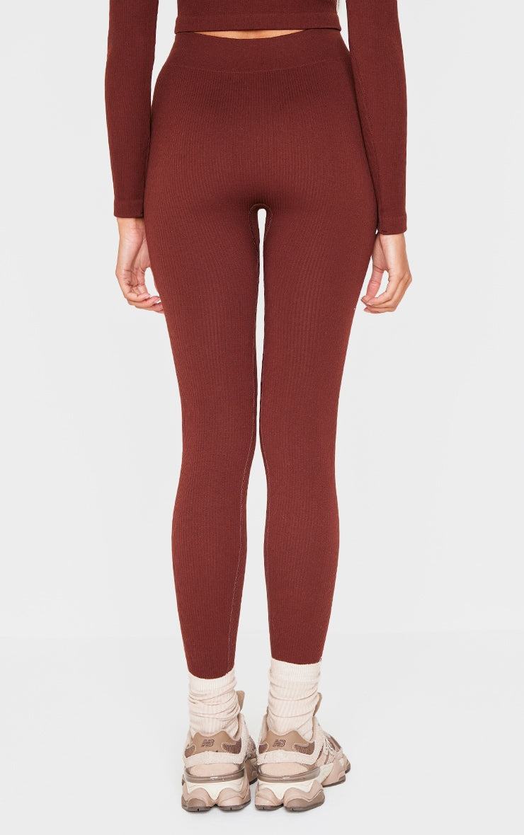 Back view of brown ribbed contour leggings in structured knit and fitted style