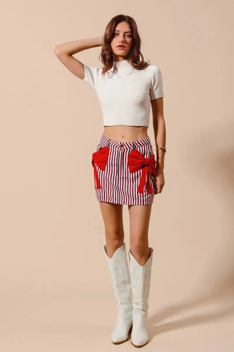 SO ME Contrast Bow Knot Pocket Fourth Of July Denim SkirtThis stylish striped denim mini skirt features a charming nautical-inspired design with bold red and white vertical stripes. Crafted from lightweight denim material,Redemption By Ashley NorthContrast Bow Knot