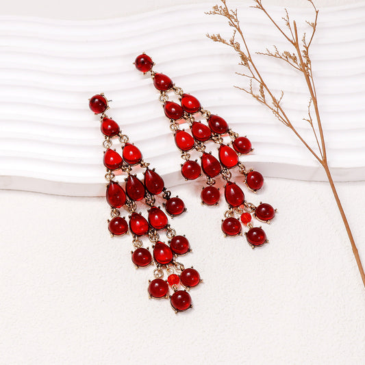 Alloy and rhinestone teardrop chandelier earrings in red with gold-tone setting