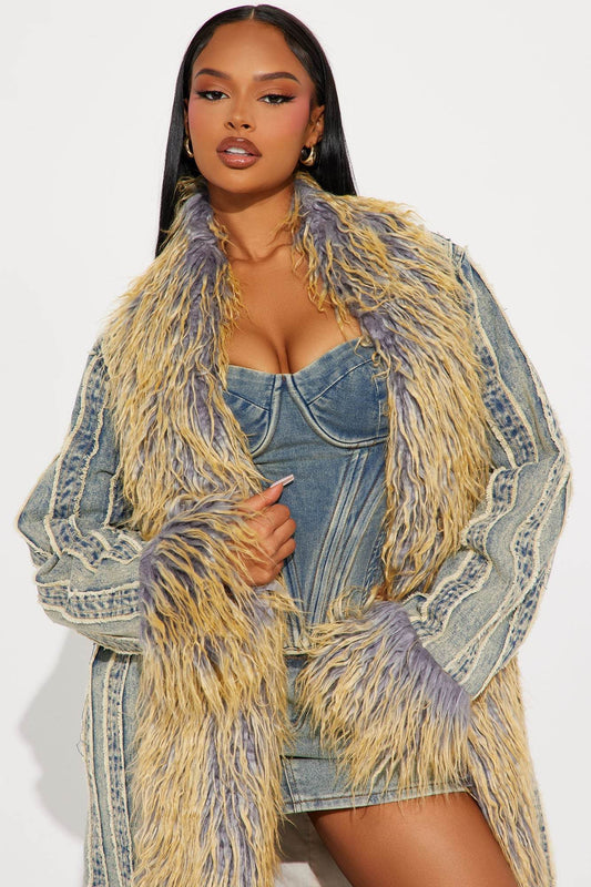 Woman wearing Love Me Not vintage wash denim trench coat with fur trim and raw hem