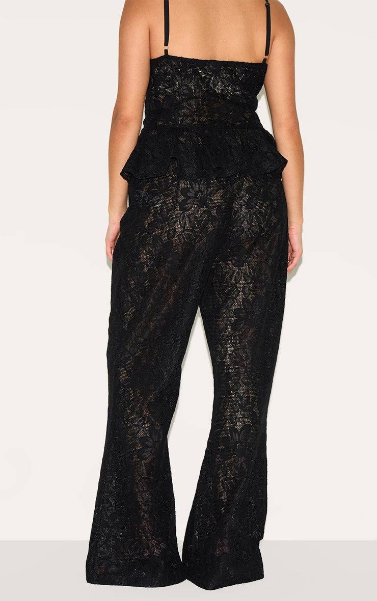 Plus Black Sheer Lace Flared Leg TrouserFinished with intricate detailing, these trousers are made from a black sheer lace material with a flattering flared high waisted fit. For the perfect co-ord, style Redemption By Ashley NorthPlus Black Sheer Lace