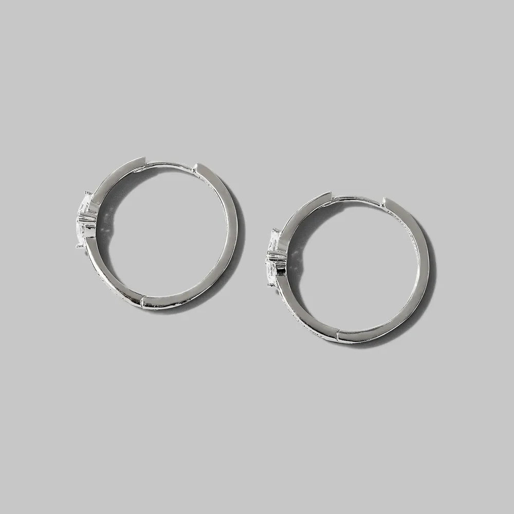 Pair of inlaid zircon 925 sterling silver hoop earrings on gray background