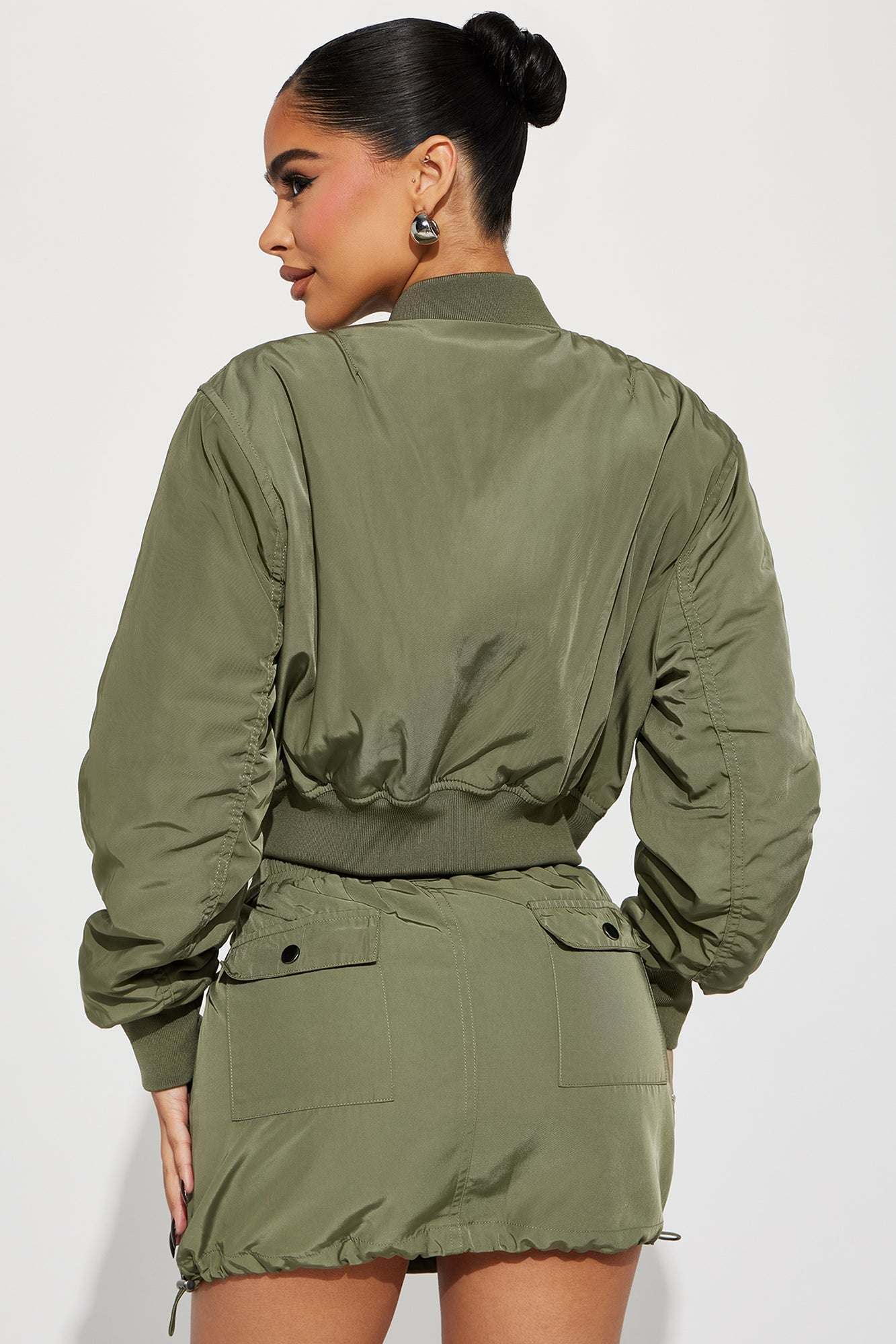 Olive bomber skirt set with cropped jacket and mini skirt back view