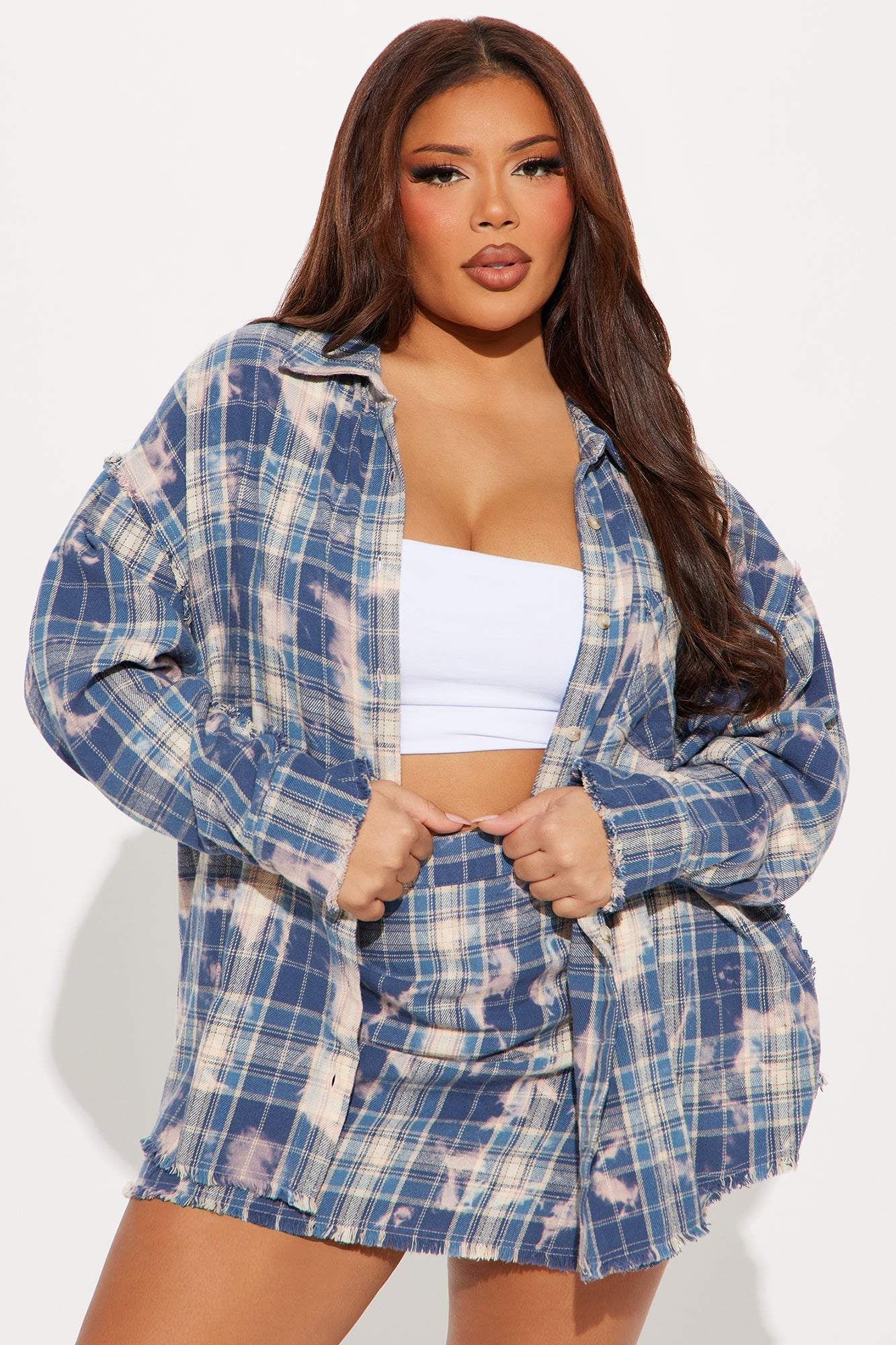 Woman wearing blue combo Brianne Plaid Skirt Set with cropped jacket and mini skirt