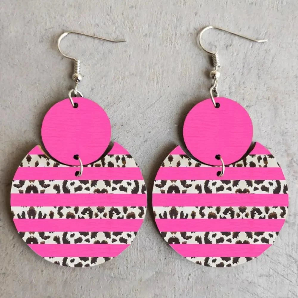Xylem Leopard Dangle Earrings with pink and leopard print circular design, 1.2 by 1.6 inches, made from xylem and cortical material.