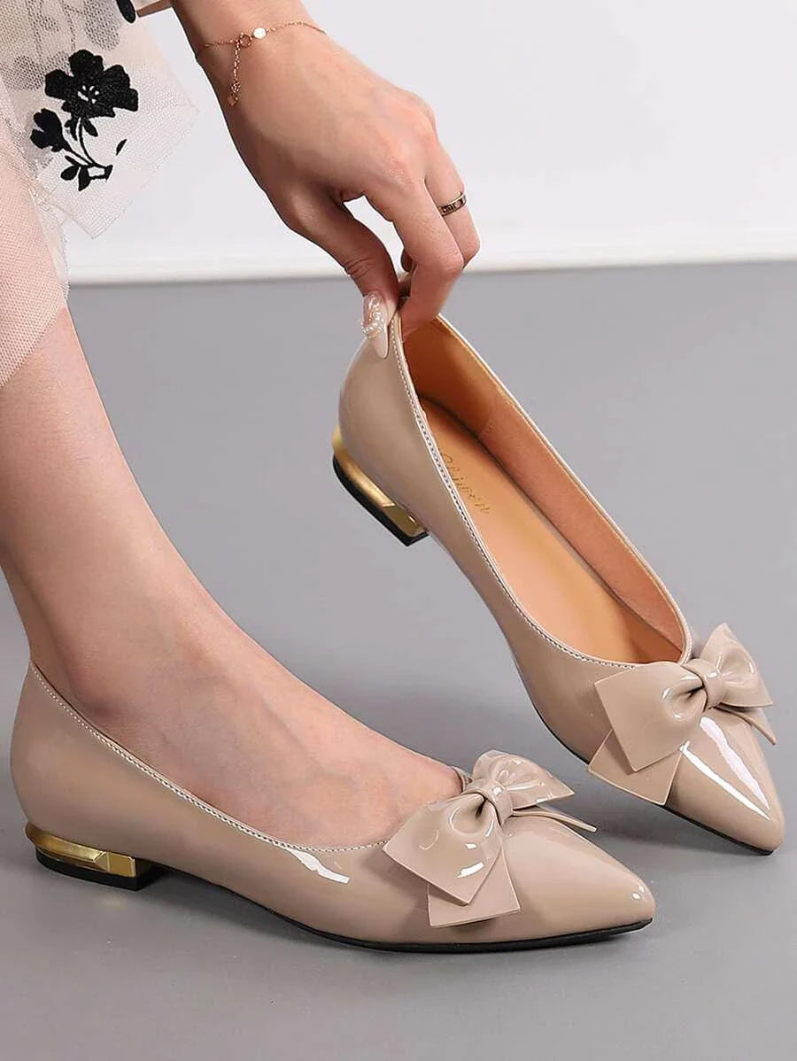 Beige women bow decor point toe flats with glossy finish and low gold-accented heel