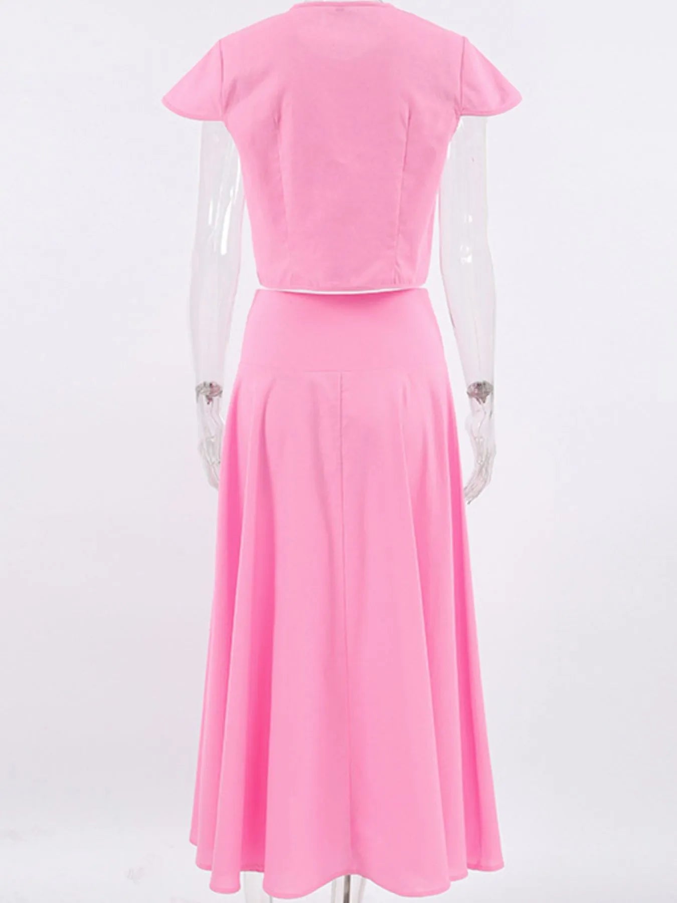 Pink short sleeve top and skirt set made of 100% cotton with button details and no stretch.