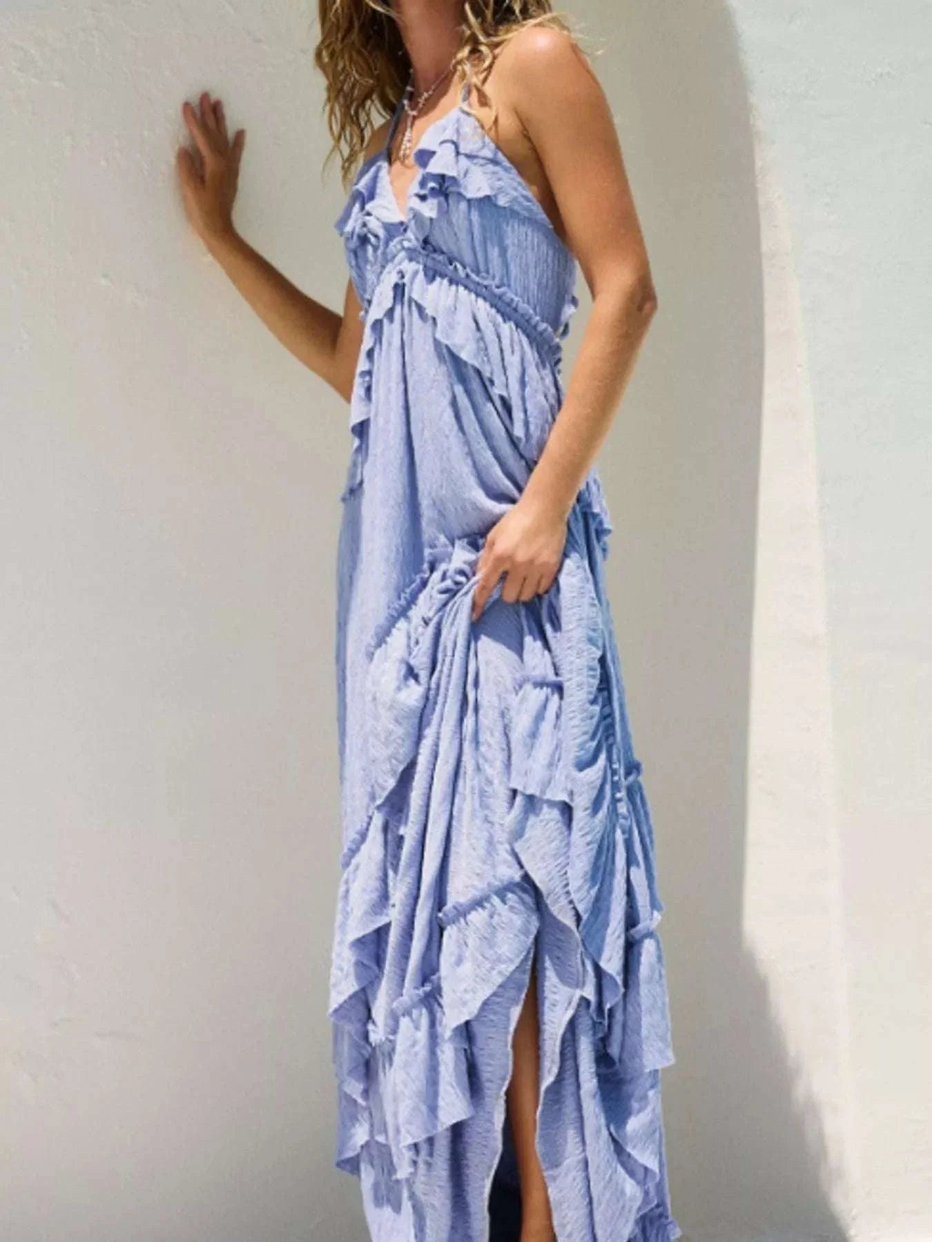 Light blue ruffled halter neck maxi dress with tied straps and flowy fabric