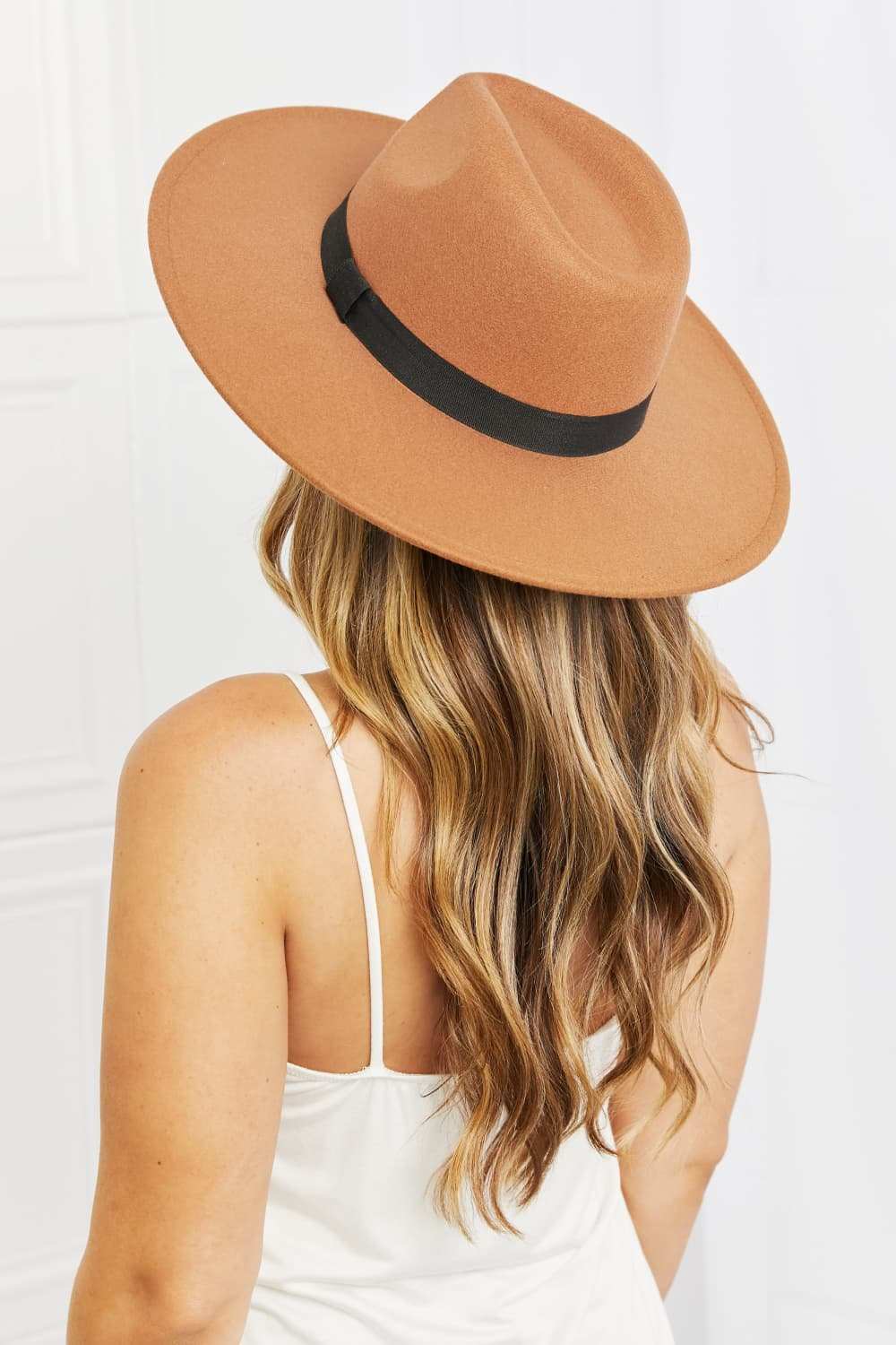 Fame Enjoy The Simple Things tan fedora hat with black ribbon on woman with long hair