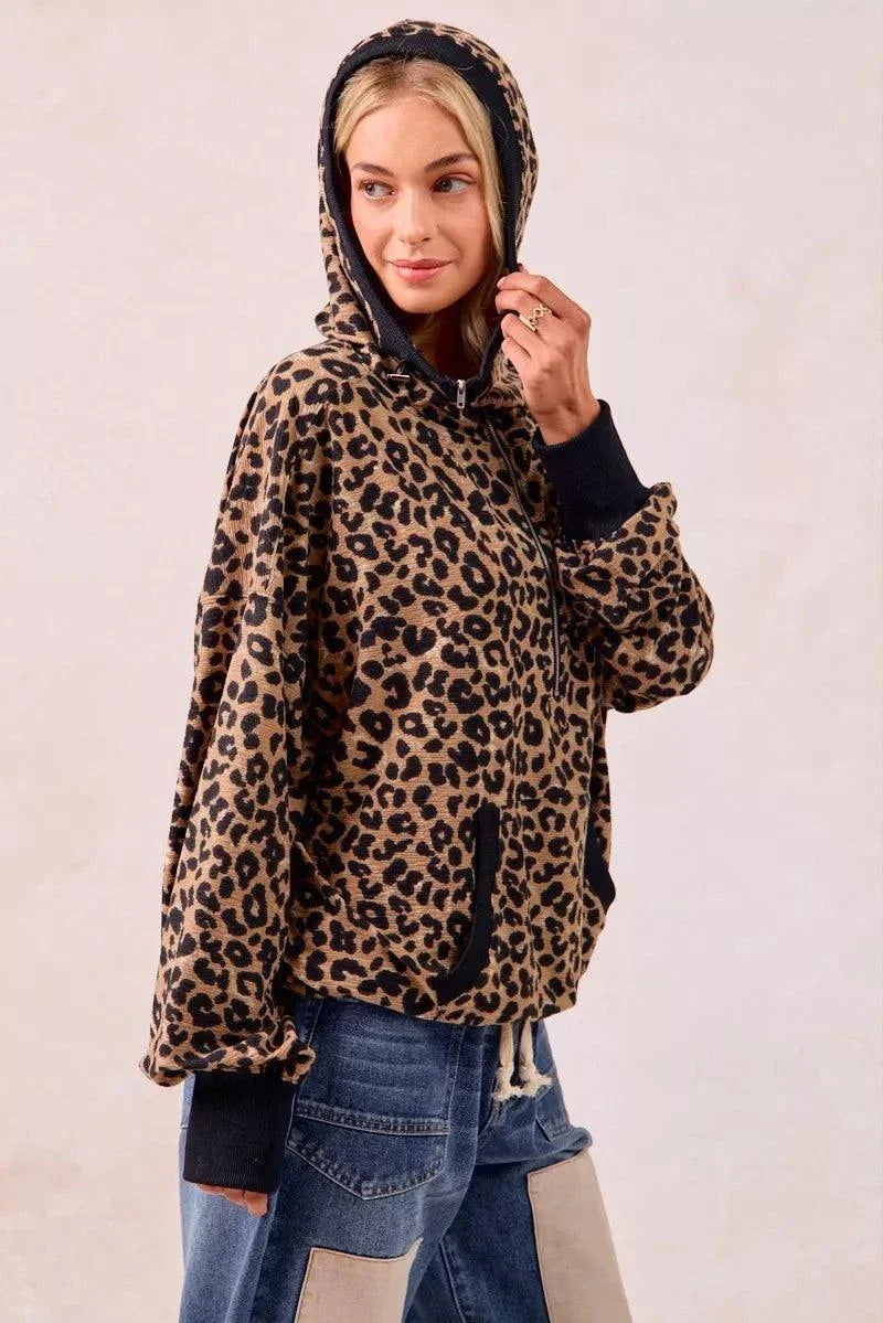 woman wearing leopard print waffle half zip hoodie with pocket and hood