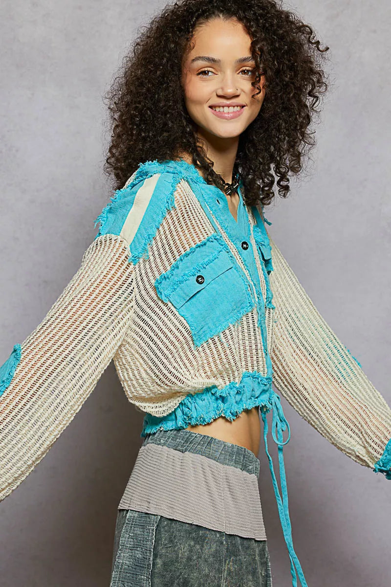 Woman wearing POL Texture Woven button down hooded shirt with turquoise accents and drawstring hem
