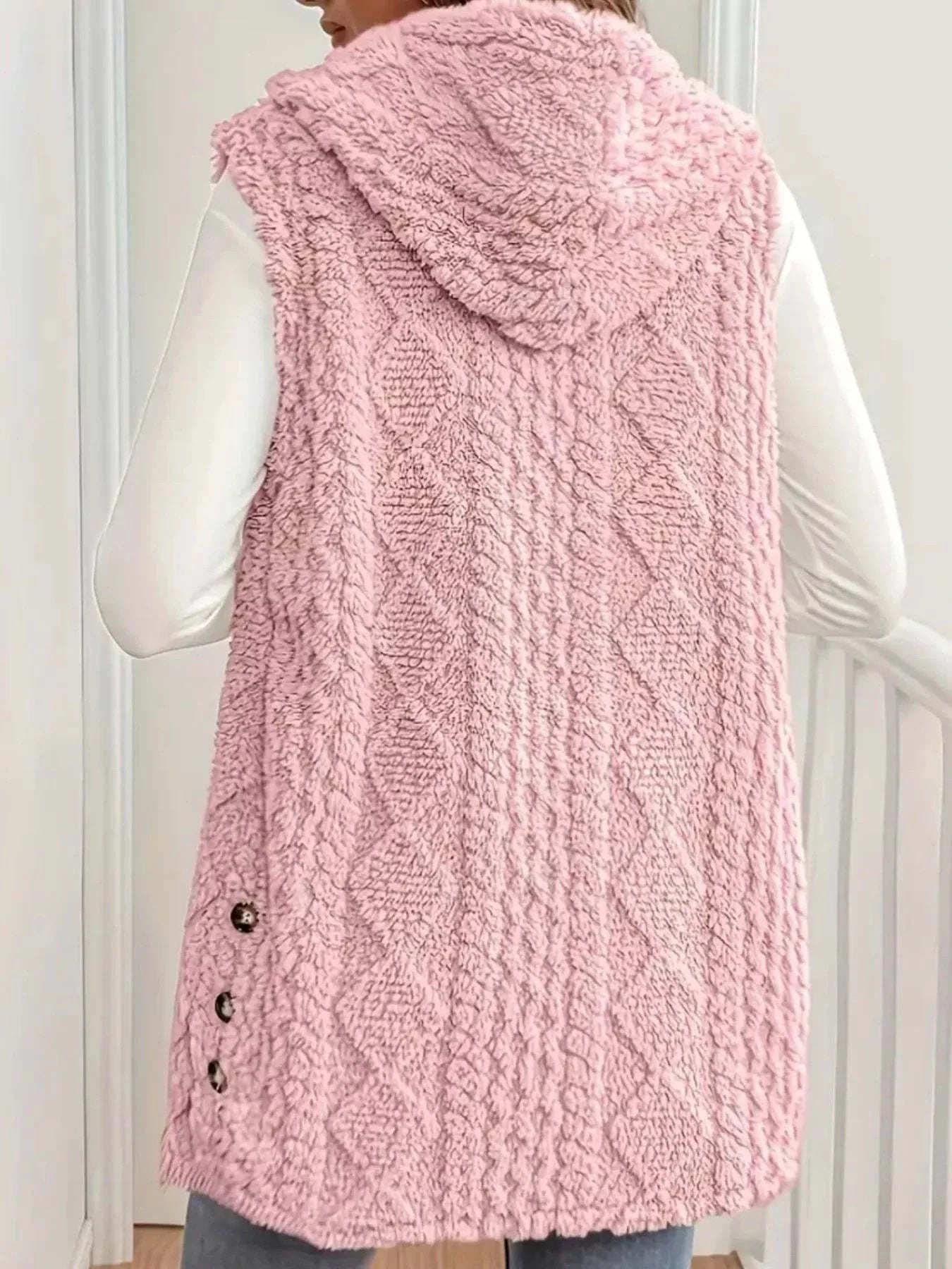 Pink button up plush hooded vest with textured knit pattern and side buttons