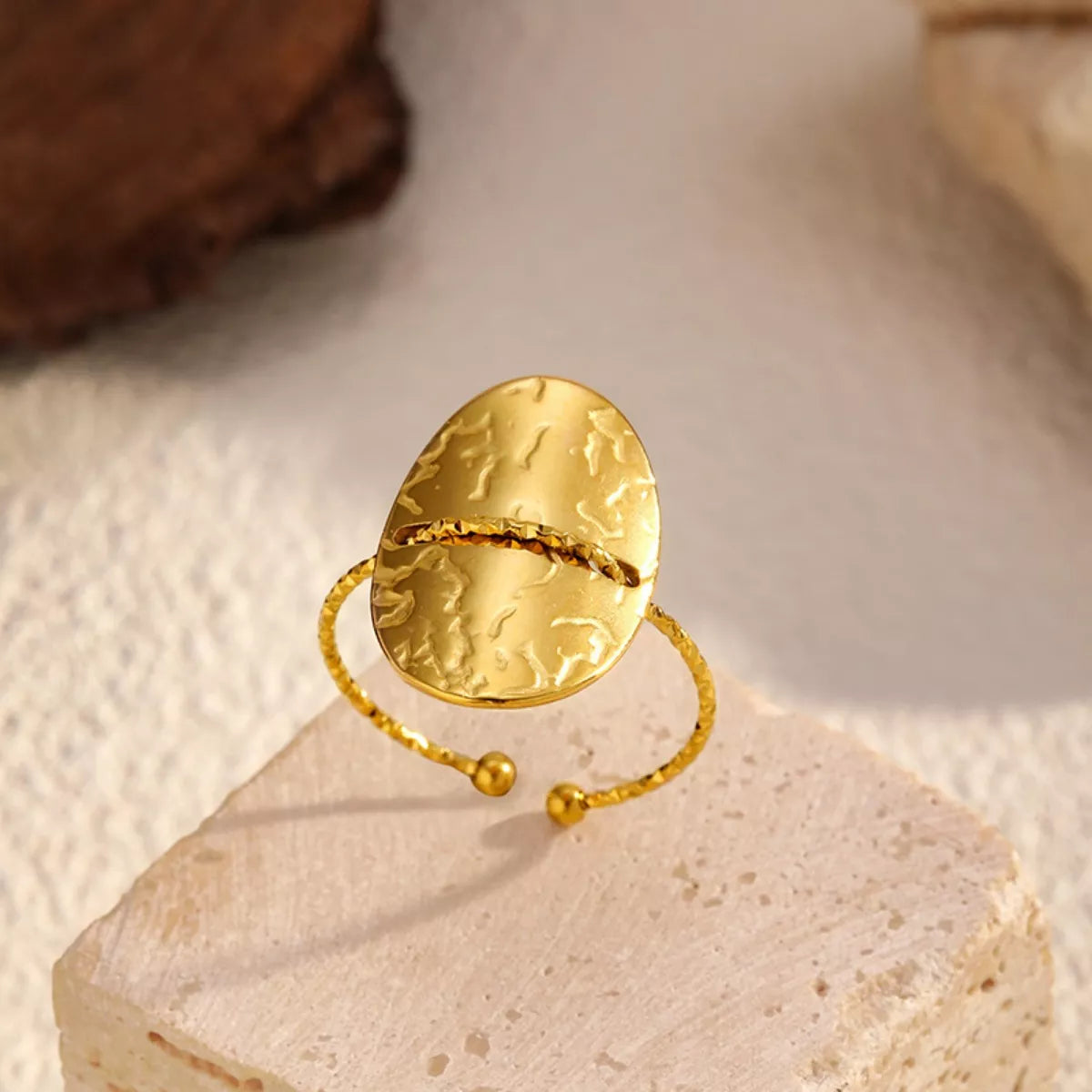 18K gold-plated hammered disc open ring on textured surface
