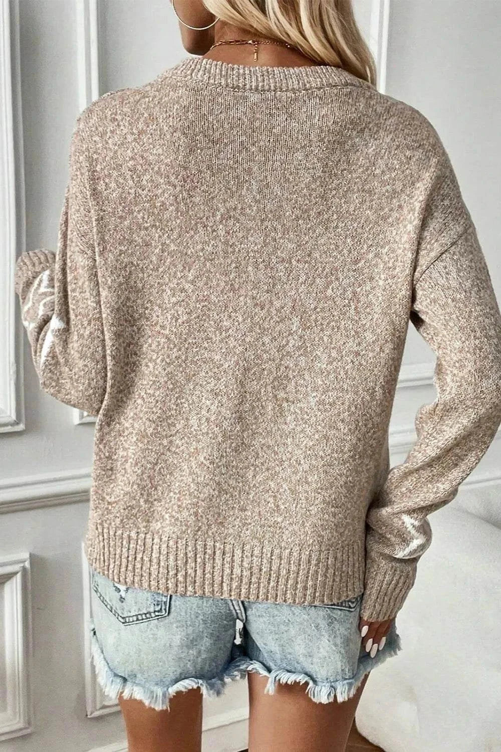 Star Round Neck dropped shoulder sweater in beige polyester knit worn with denim shorts back view