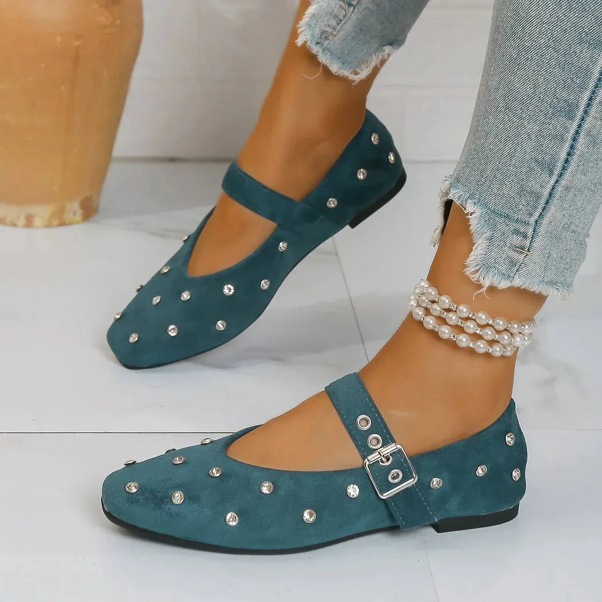 Teal flat Mary Jane loafers with rhinestone buckle and studded embellishments on PU leather and suede material