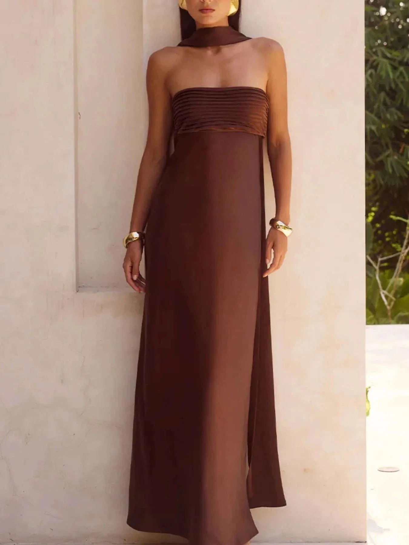 Brown tube mermaid maxi dress with slit and zipper detail, sleeveless and strapless design, made from 100% polyester, machine washable.