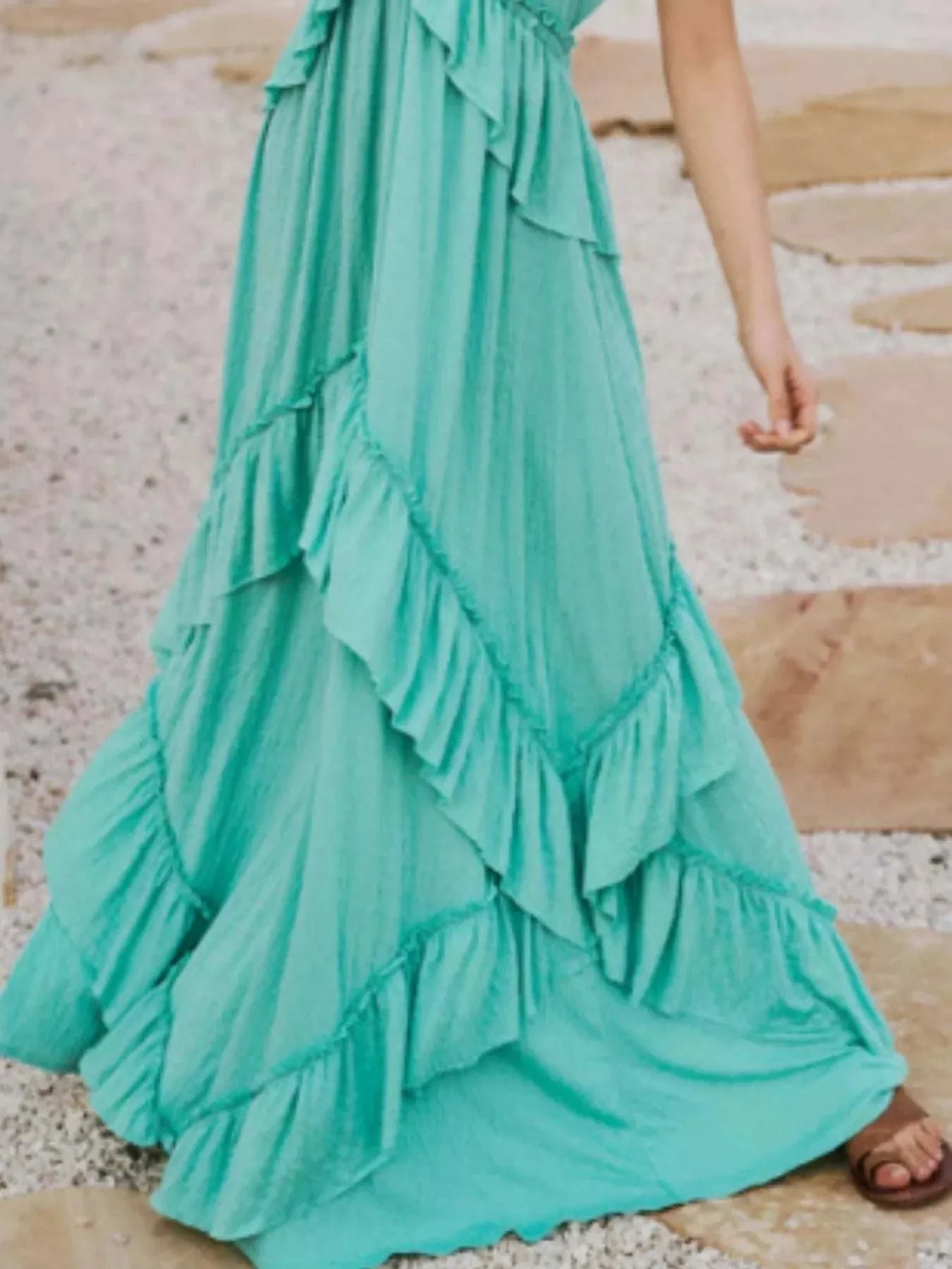 Light blue ruffled halter neck maxi dress with layered frills and flowing design