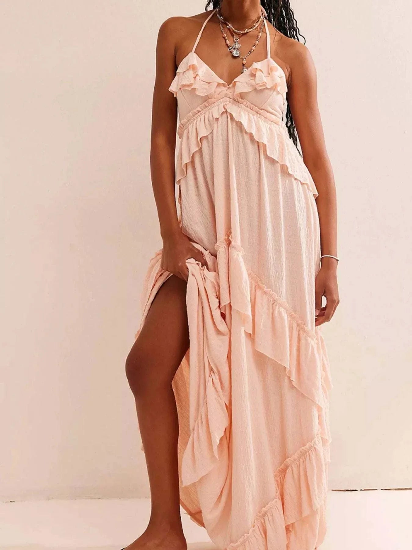 Pink ruffled halter neck maxi dress with layered design and tie neckline