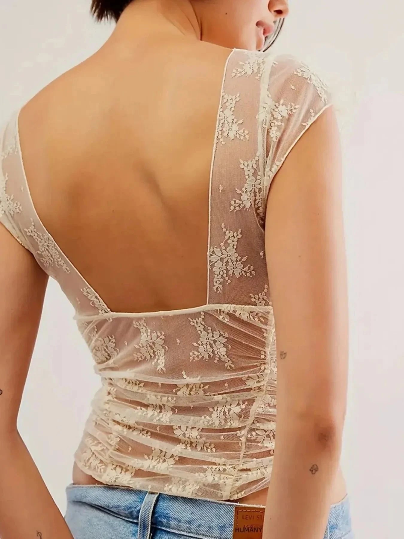 Lace Cap Sleeve T-Shirt with Ruched Design.