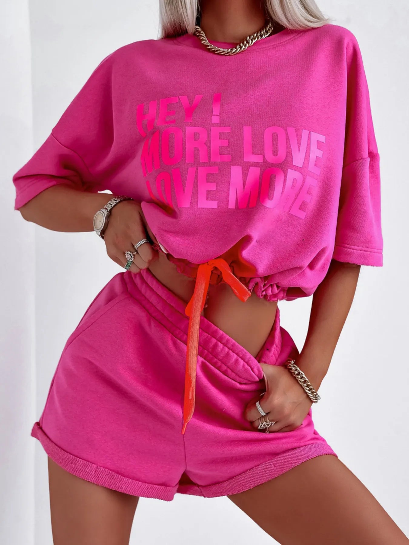 Pink letter graphic top and shorts set with drawstring waist and slightly stretchy polyester fabric