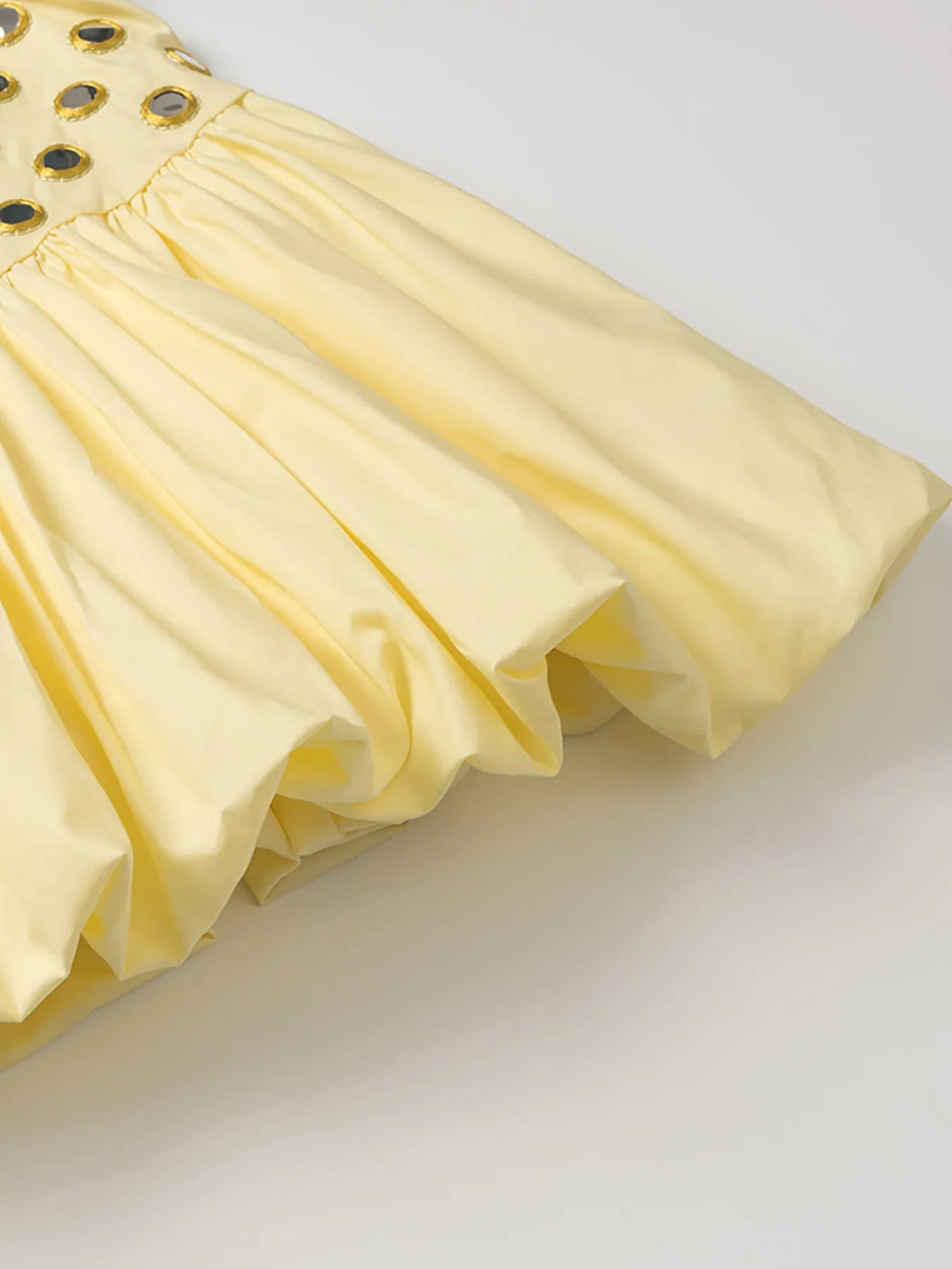 Yellow eyelet cami and bubble skirt set with cutout and ruffled design
