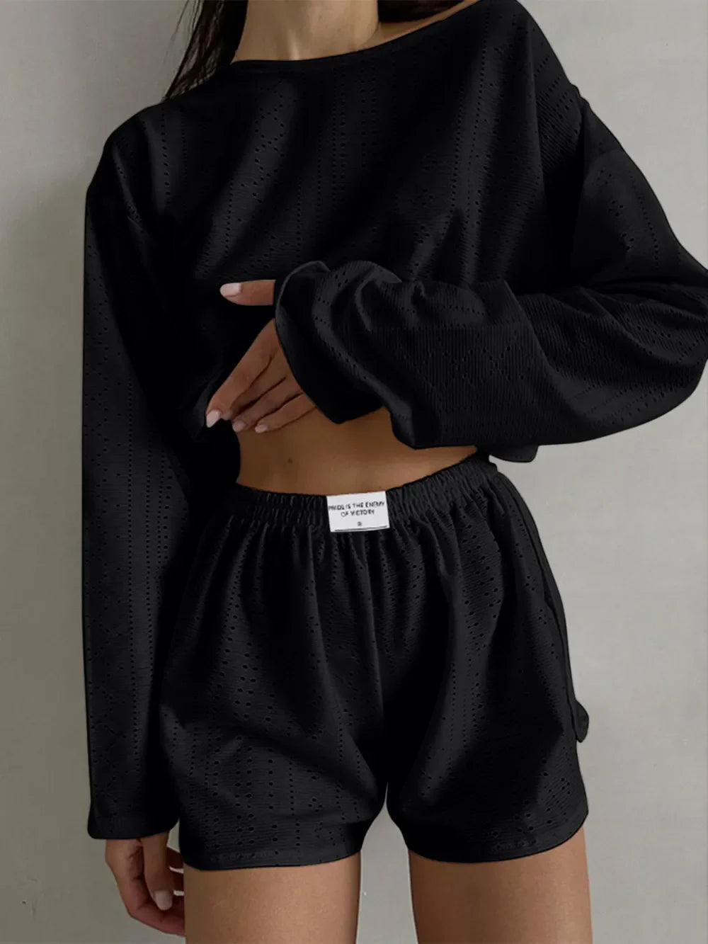 Black eyelet round neck top and shorts two-piece set with slight stretch