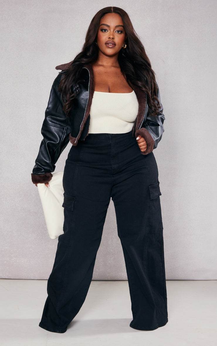 Plus Black Cargo Wide Leg JeansReimagine utilitarian style with these black, wide-leg cargo jeans. Cut from durable denim, these jeans offer a contemporary take on a classic silhouette. The multipRedemption By Ashley NorthPlus Black Cargo