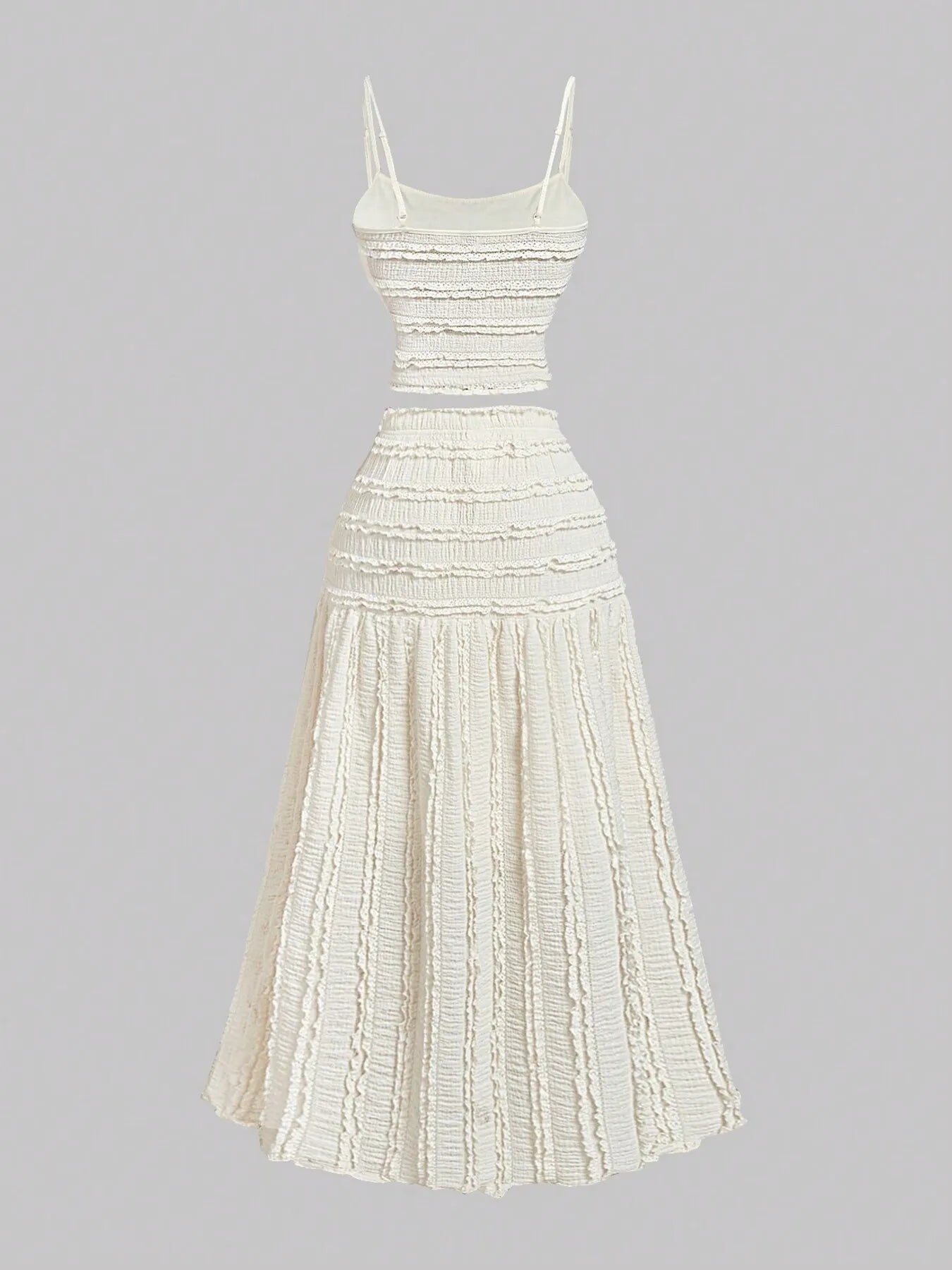 White frill scoop neck cami and tiered skirt set with ruched and smocked detailing, made of 100% polyester.