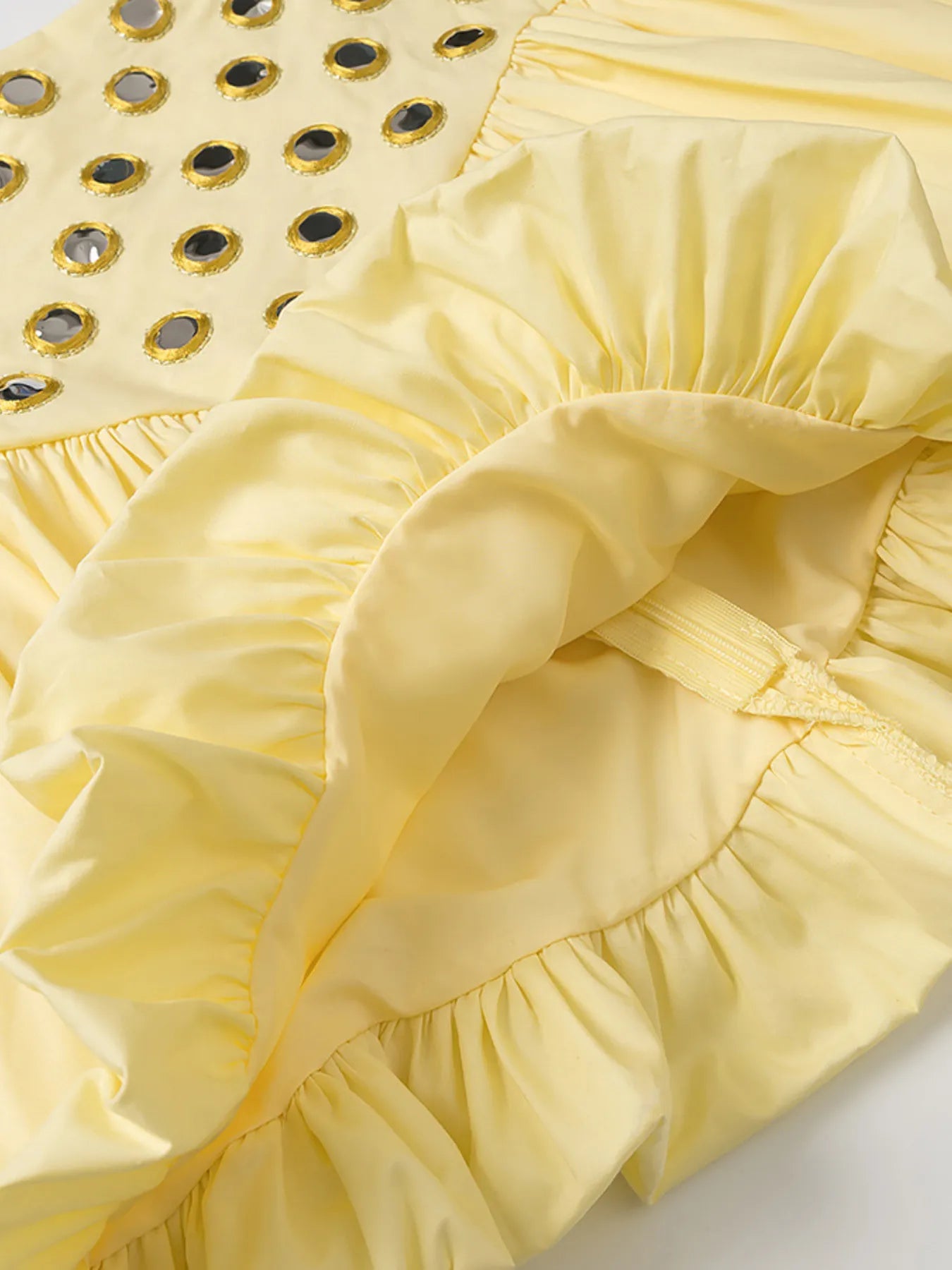 Yellow eyelet cami and bubble skirt set with cutout and ruffled details