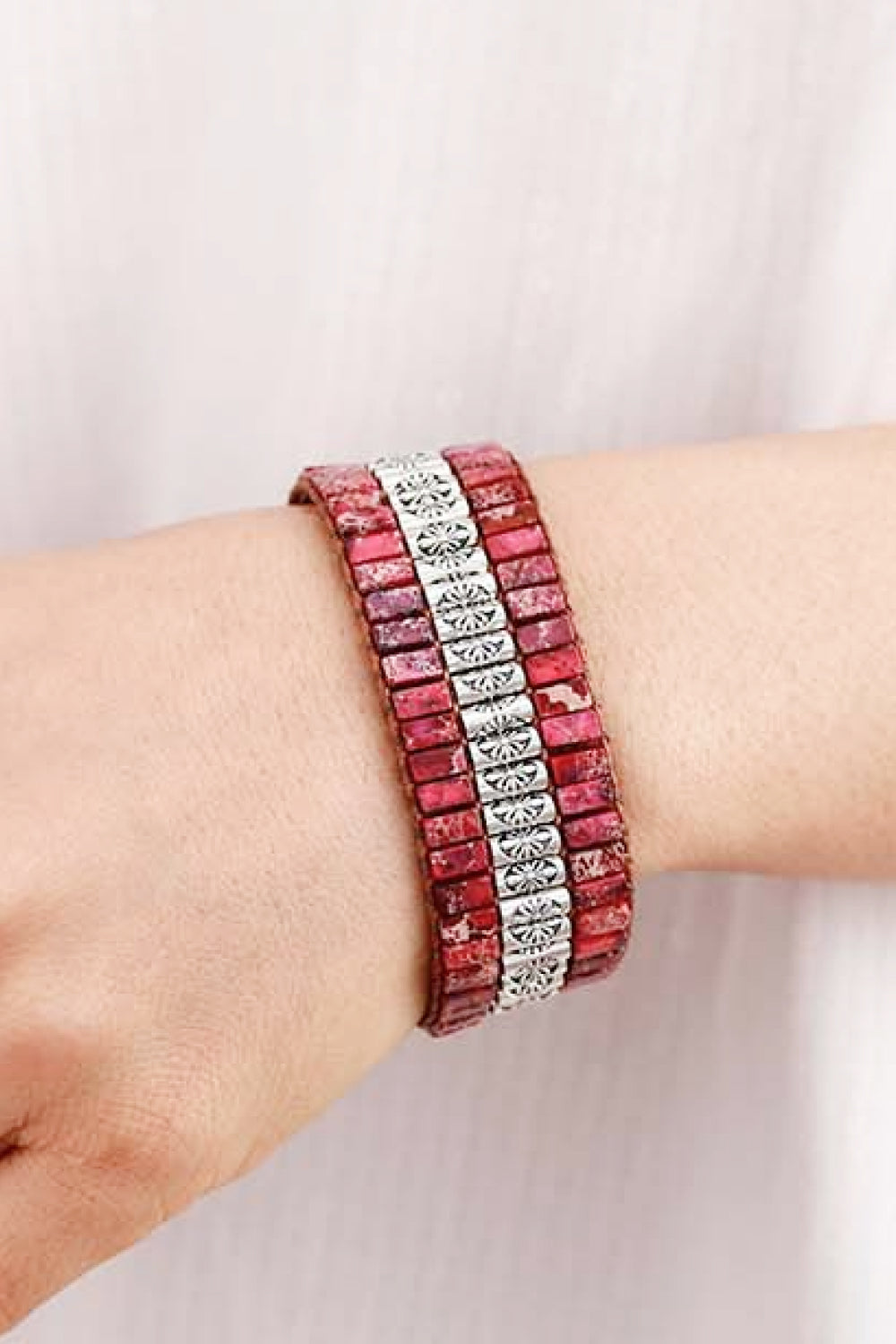 Handmade triple layer natural stone bracelet with red stones and alloy accents on wrist