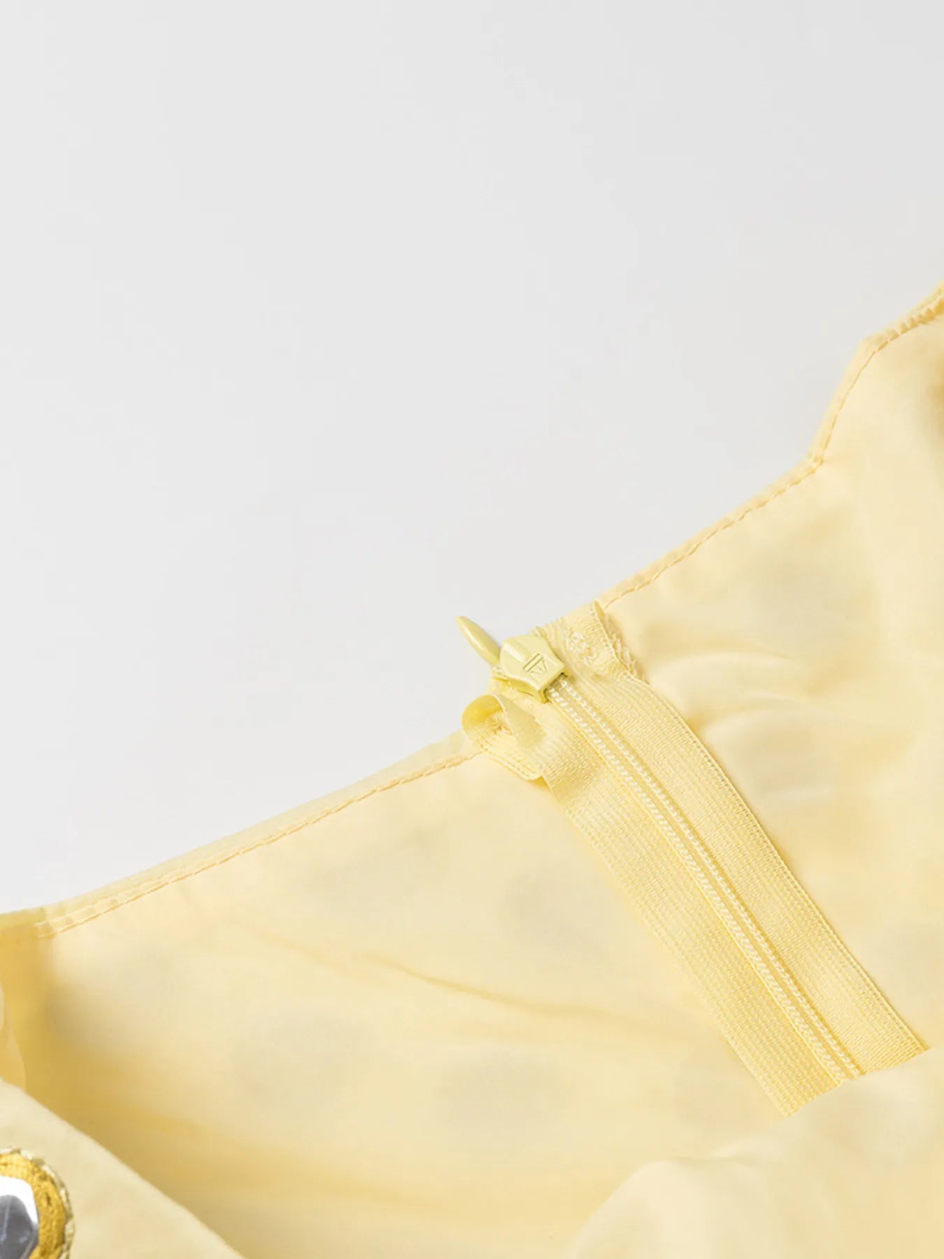 yellow eyelet cami and bubble skirt set with zipper detail