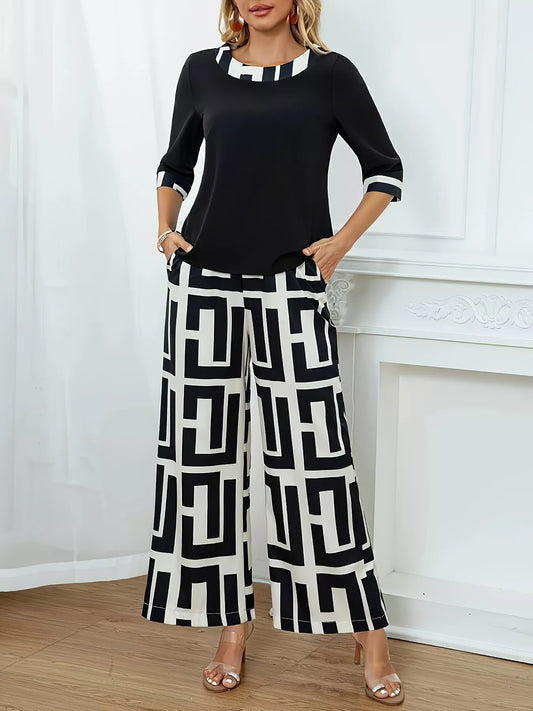 Woman wearing geometric print round neck top and matching wide-leg pants two-piece set with black and white pattern