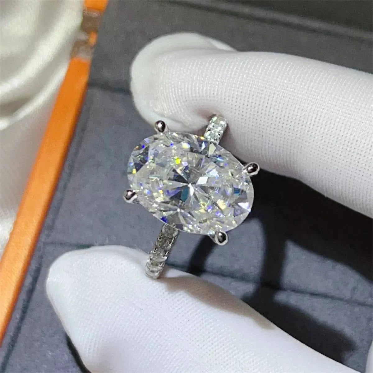 8 Carat Moissanite 925 sterling silver ring with large oval stone and platinum-plated band in jewelry box