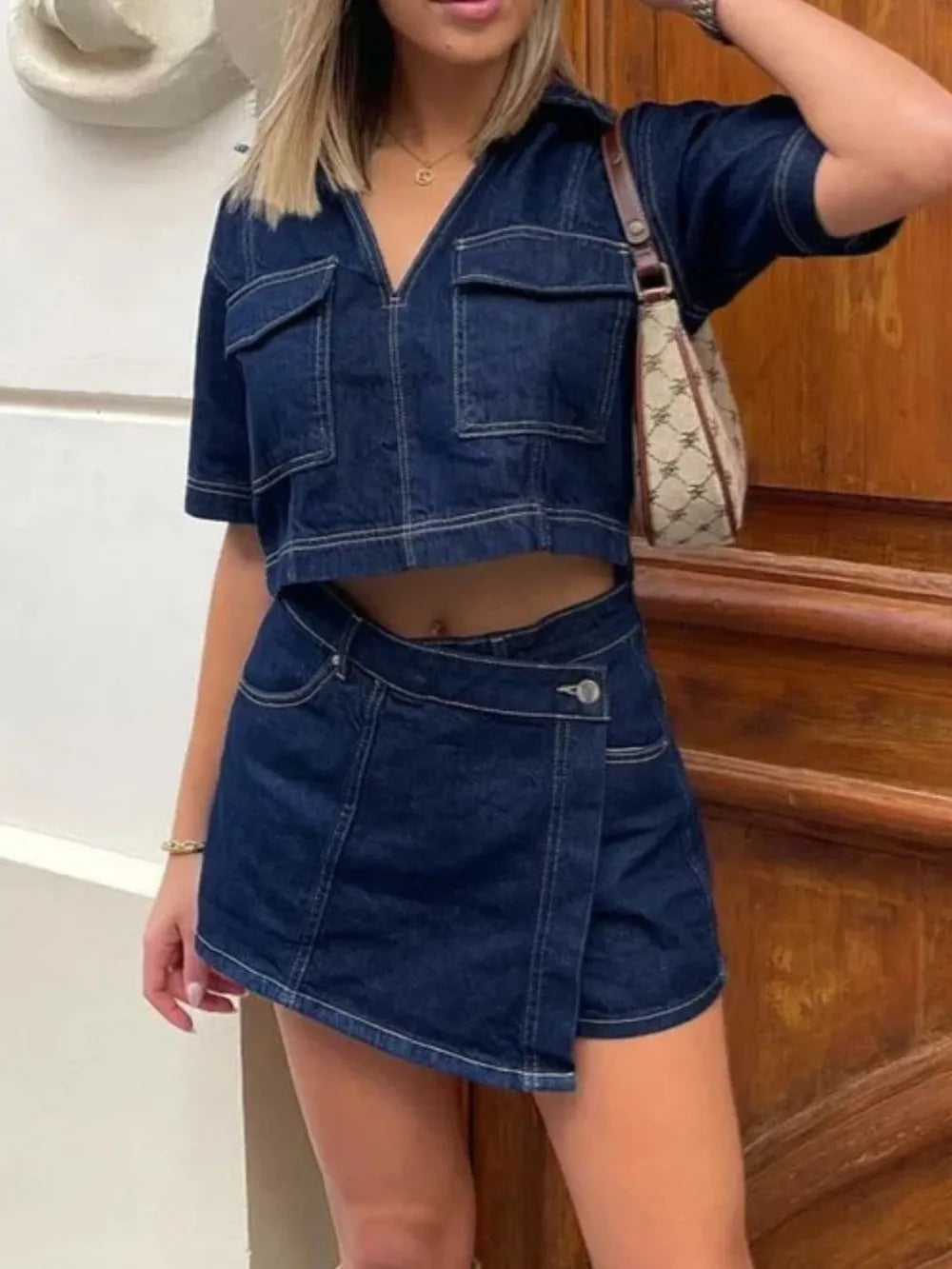 Woman wearing Johnny Collar Short Sleeve Top and Skort Denim Set buttoned two-piece outfit