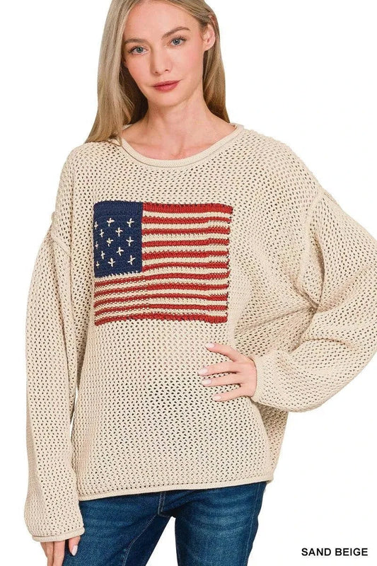Sand beige American Flag crew neck sweater in openwork knit design worn by woman