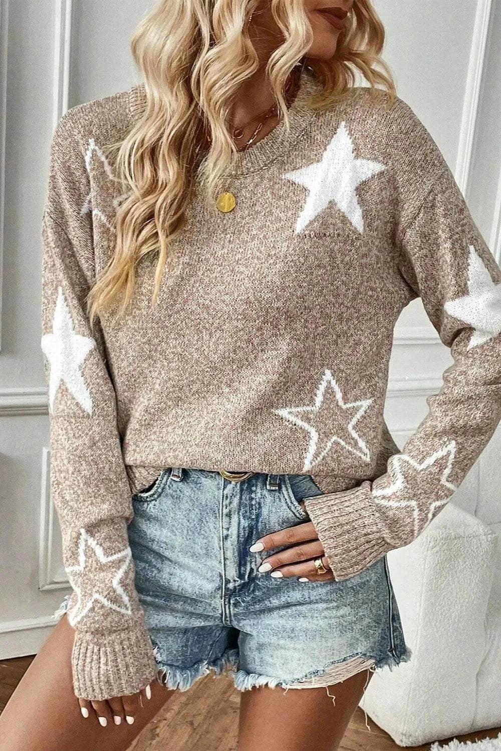 beige Star Round Neck dropped shoulder sweater with white star patterns, worn with denim shorts