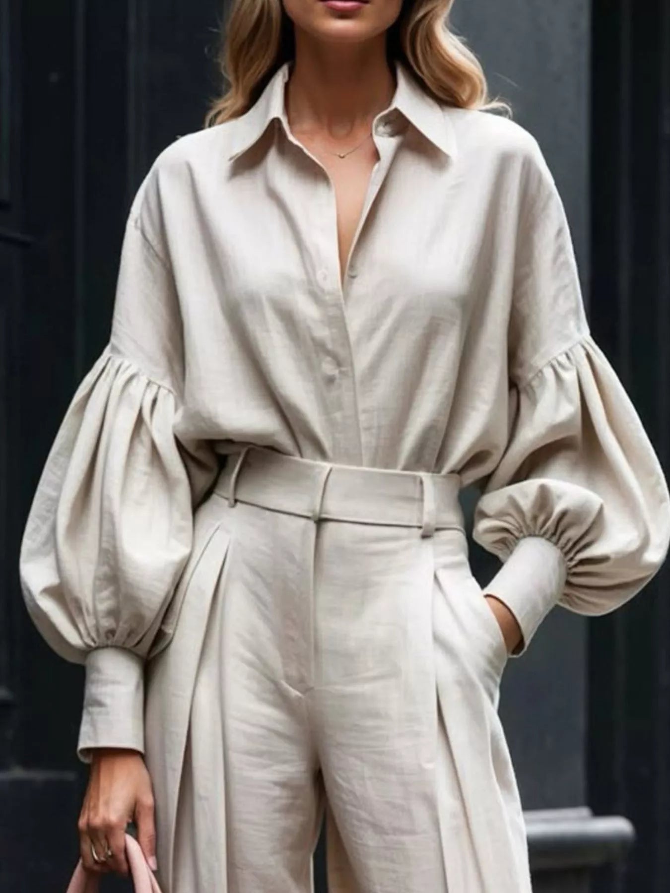 Woman wearing beige lantern sleeve shirt and high-waist wide leg pants set