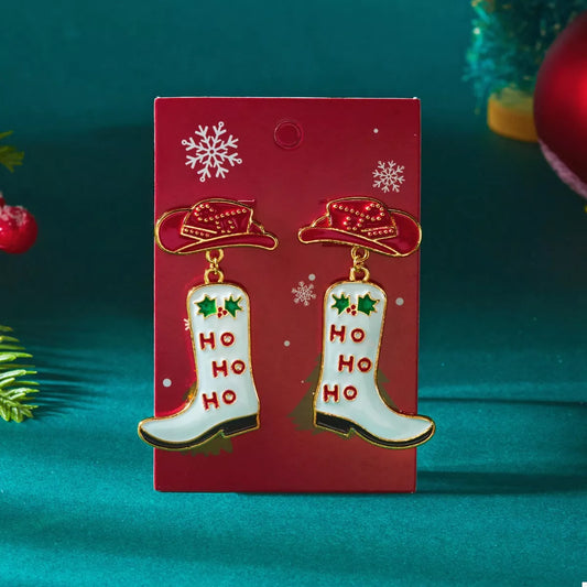Festive Christmas cowboy boots earrings with "Ho Ho Ho" and cowboy hat design on red holiday card background