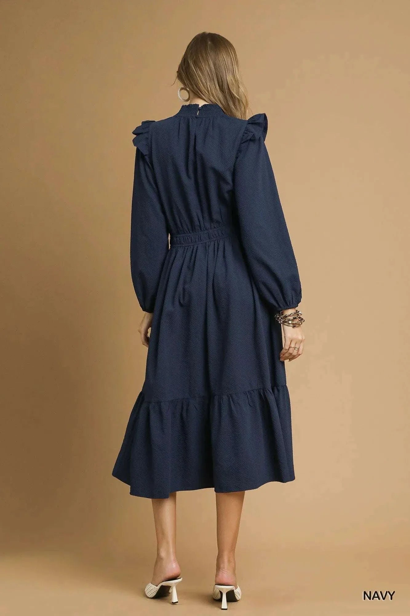 Back view of navy Umgee Textured Midi Dress with ruffle shoulder detail worn by a model