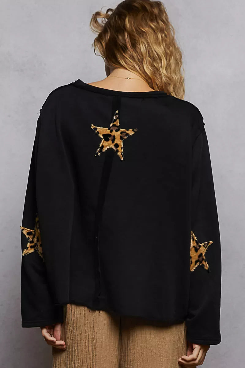 Back view of black POL Round Neck long sleeve sweatshirt with leopard print star patches and raw hem